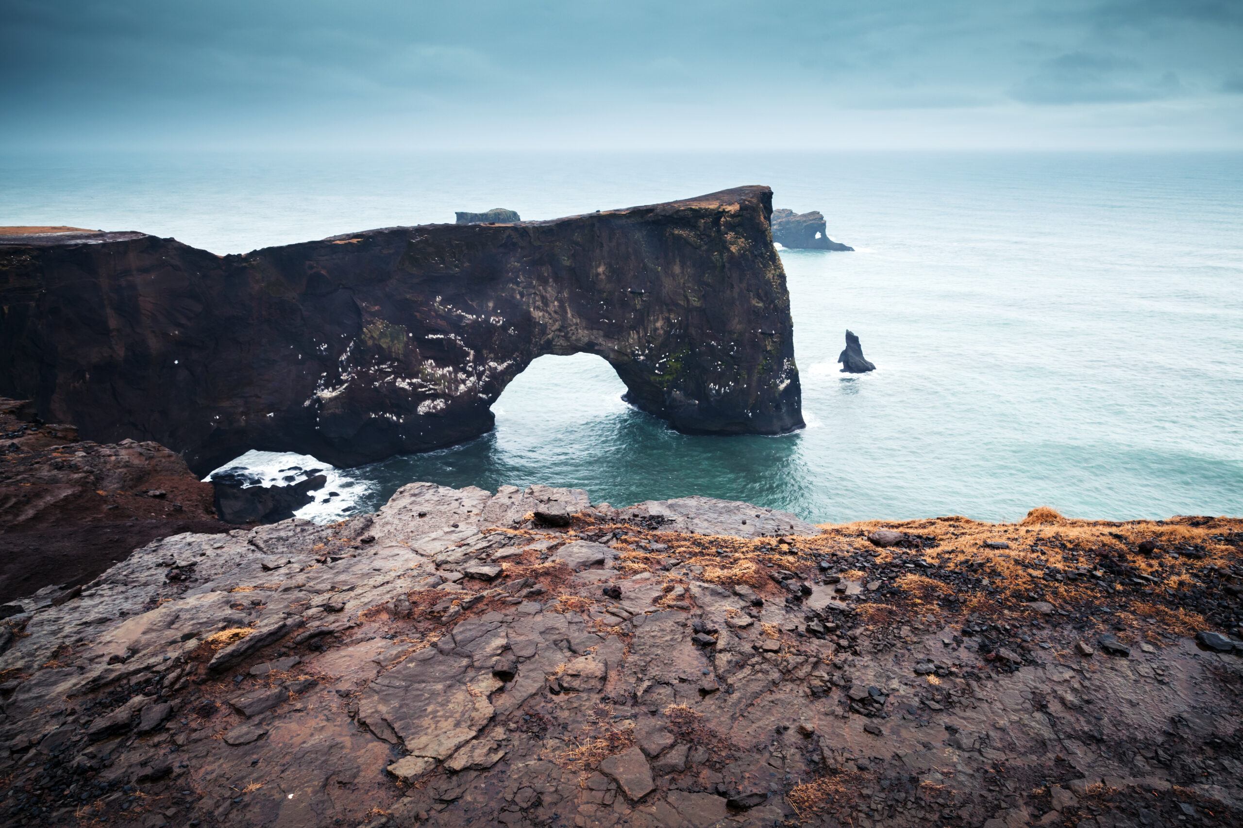Natural rocky arch. Scenic landscape of Iceland