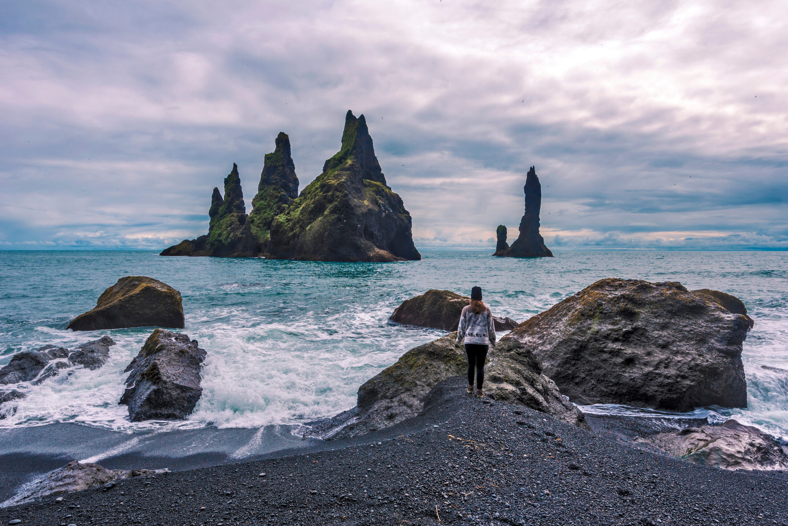 Girl,Teenager,Approaching,Seashore,Facing,To,Reynisdrangar,Basalt,Sea,Stacks.